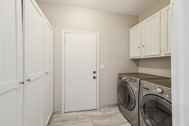 laundry area with cabinets and washing machine and dryer