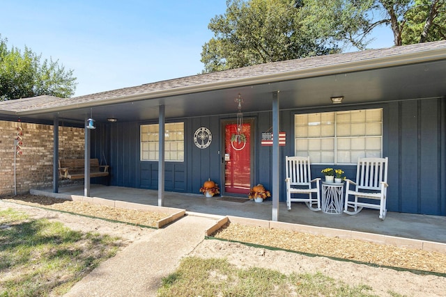 doorway to property with covered porch