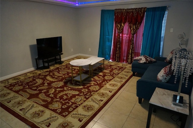 tiled living room with a tray ceiling