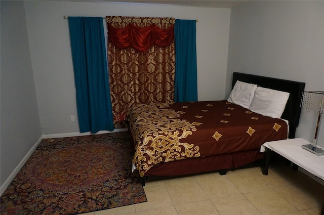 bedroom featuring light tile patterned flooring