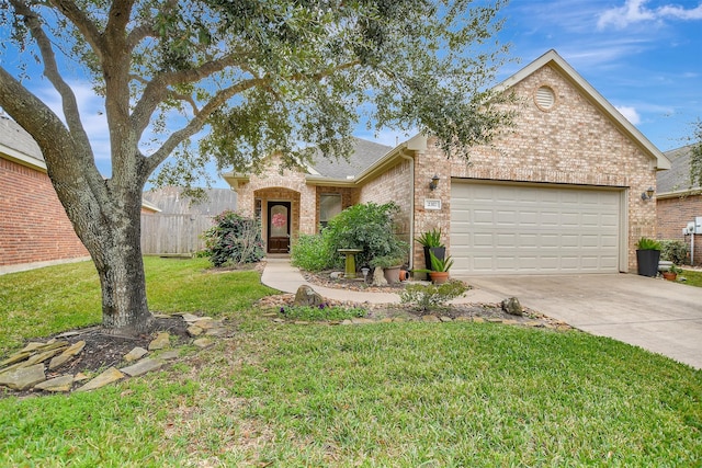 view of front of property featuring a front lawn and a garage