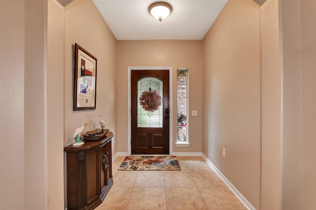 foyer featuring light tile patterned flooring