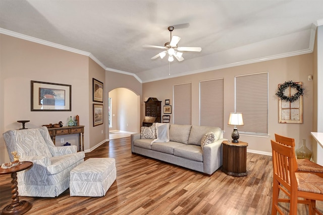 living room with ceiling fan, crown molding, and hardwood / wood-style floors