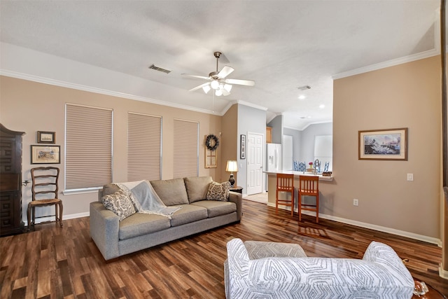 living room featuring lofted ceiling, ceiling fan, crown molding, and dark hardwood / wood-style flooring