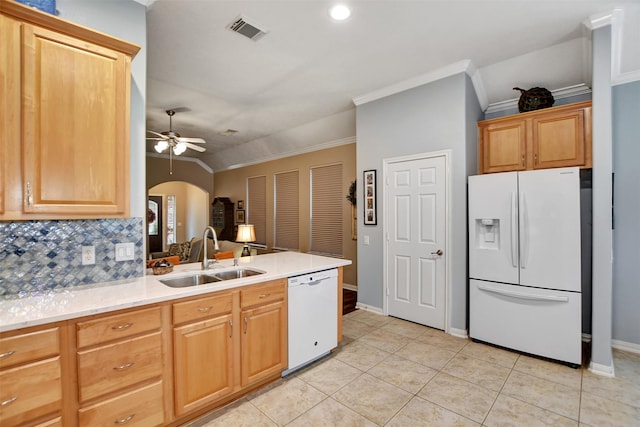 kitchen with sink, vaulted ceiling, white appliances, ceiling fan, and backsplash