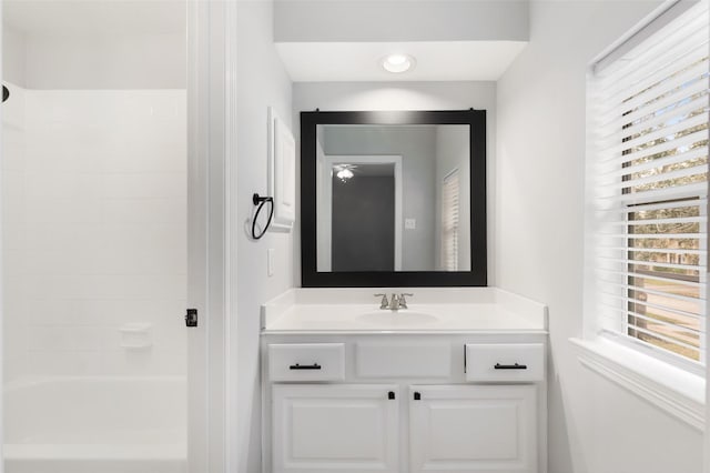 bathroom with tub / shower combination and vanity