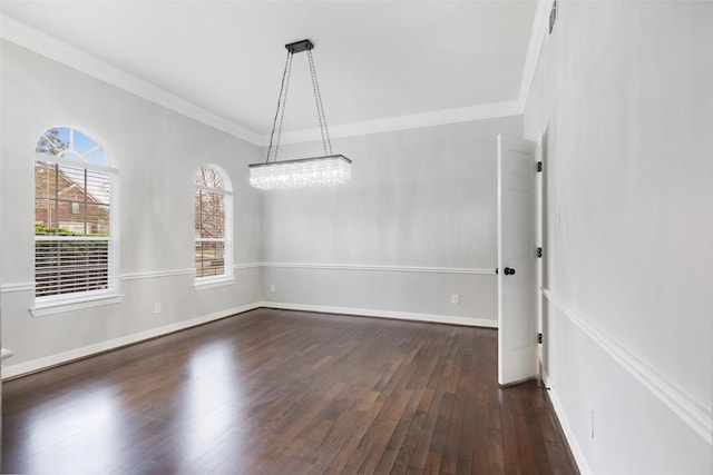 unfurnished dining area featuring a notable chandelier, crown molding, and dark hardwood / wood-style flooring