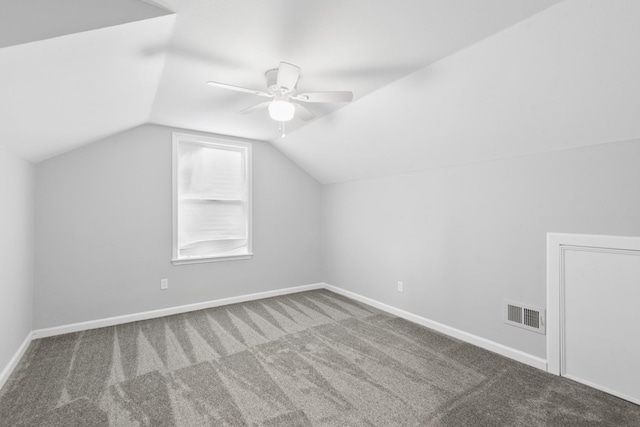 additional living space featuring lofted ceiling, carpet floors, and ceiling fan