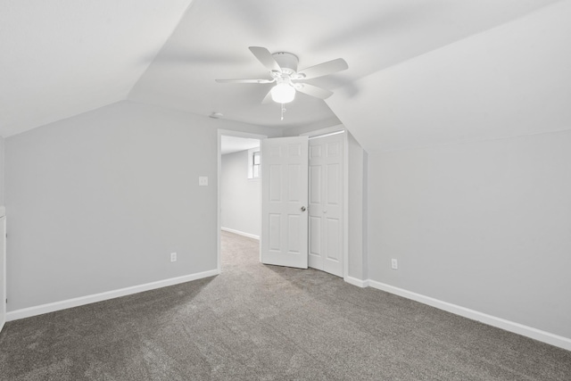 additional living space featuring ceiling fan, vaulted ceiling, and carpet floors