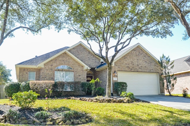 ranch-style house with a garage and a front lawn