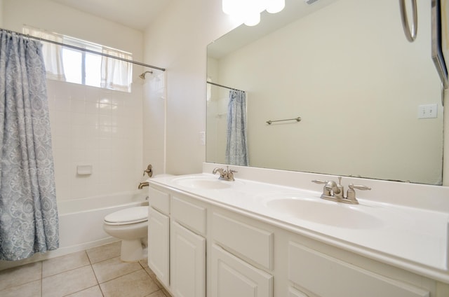 full bathroom featuring toilet, vanity, tile patterned flooring, and shower / tub combo with curtain