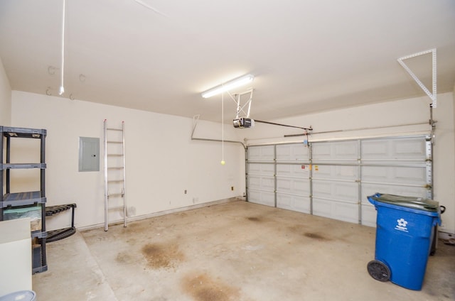 garage with a garage door opener and electric panel