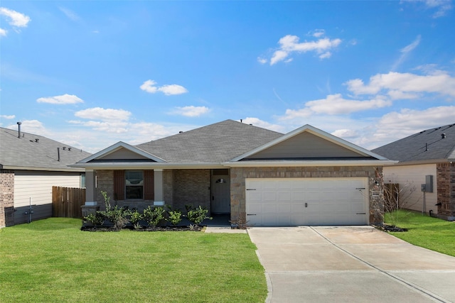 ranch-style house featuring a garage and a front lawn