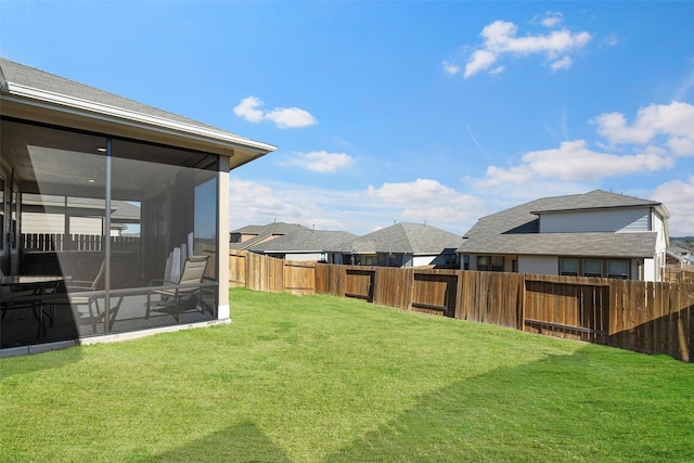 view of yard with a sunroom