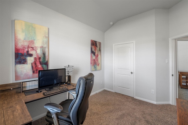 carpeted home office with lofted ceiling