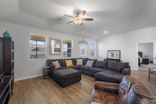 living room with wood-type flooring, ceiling fan, and vaulted ceiling