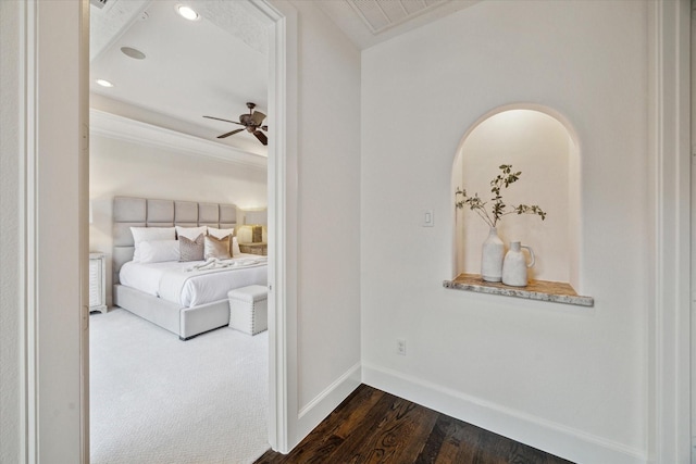 bedroom with ceiling fan and dark hardwood / wood-style flooring