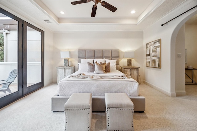 carpeted bedroom featuring a raised ceiling, ceiling fan, access to outside, and ornamental molding