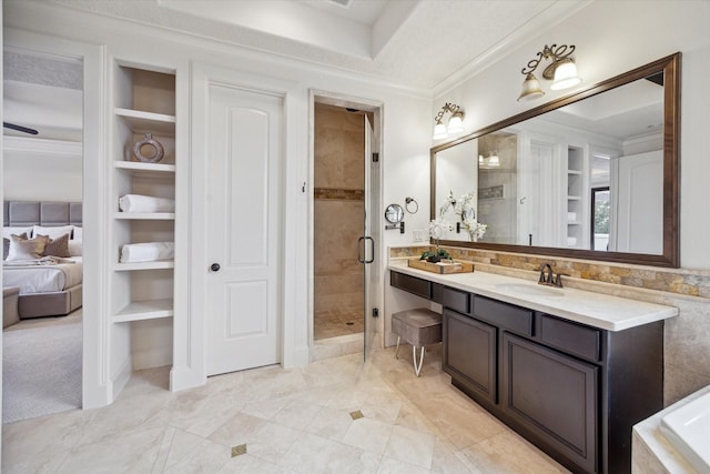 bathroom featuring vanity, built in features, crown molding, and an enclosed shower