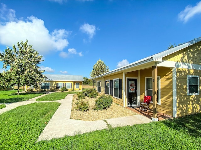 back of house with a yard