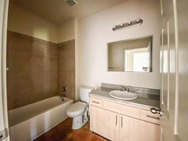 full bathroom with toilet, tiled shower / bath, and vanity