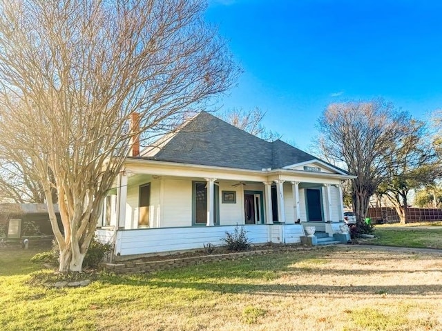 view of front of home featuring a front yard and a porch