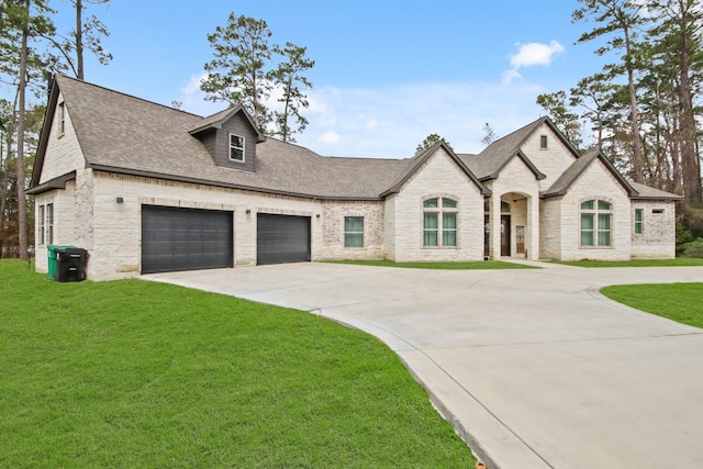 french country inspired facade featuring a front yard