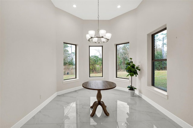 unfurnished dining area featuring a notable chandelier