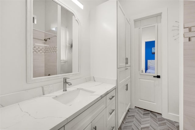 bathroom with vanity and walk in shower