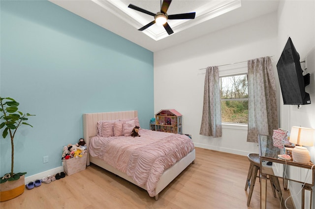 bedroom featuring light hardwood / wood-style flooring and ceiling fan