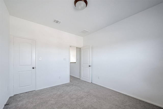 empty room with light colored carpet