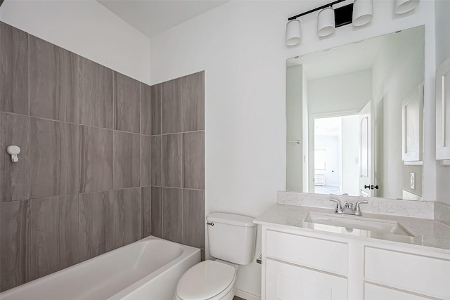 full bathroom featuring toilet, vanity, and bathtub / shower combination