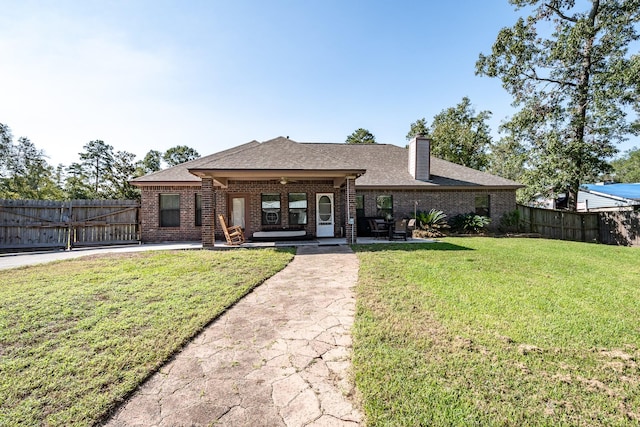 view of front of house featuring a patio area and a front yard