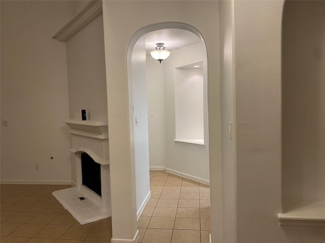 hallway featuring light tile patterned flooring