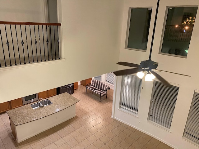 bathroom featuring sink, ceiling fan, and tile patterned flooring