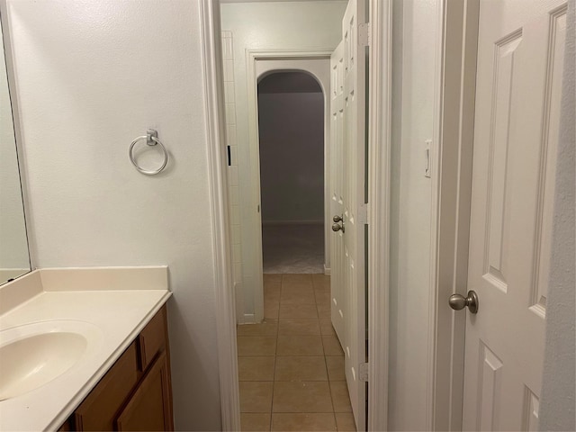 bathroom with tile patterned flooring and vanity