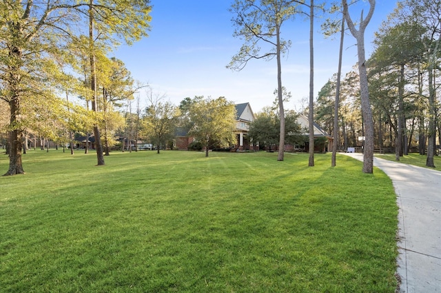 view of home's community featuring a lawn