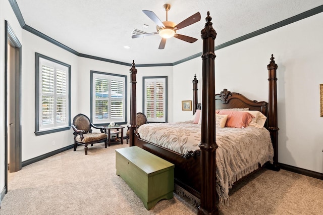 carpeted bedroom with a textured ceiling, ceiling fan, and crown molding