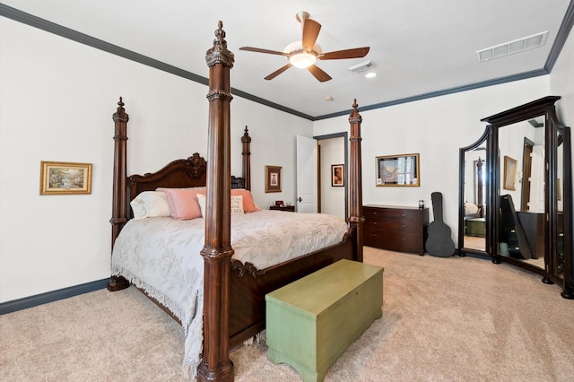 carpeted bedroom with ceiling fan and crown molding