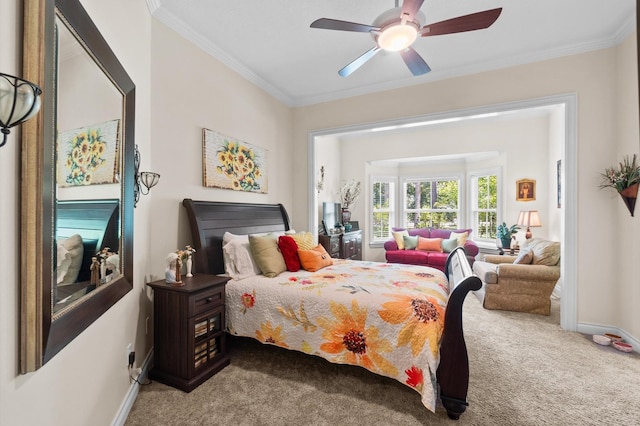 carpeted bedroom featuring ceiling fan and ornamental molding