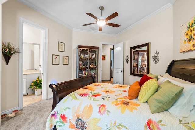 carpeted bedroom featuring ensuite bath, ceiling fan, and crown molding