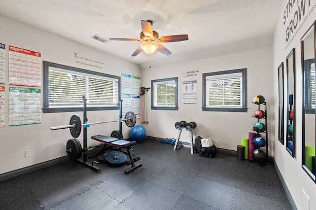 exercise room featuring ceiling fan