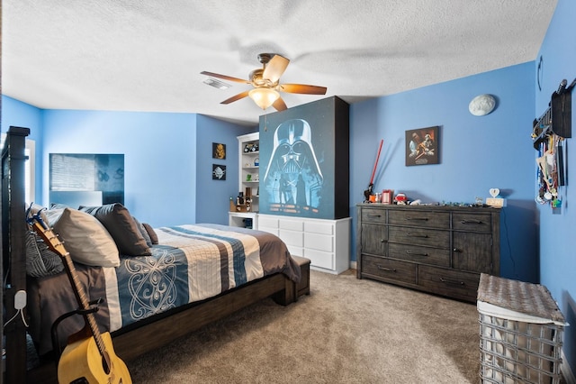 carpeted bedroom featuring a textured ceiling and ceiling fan