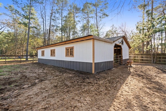 view of home's exterior with an outbuilding