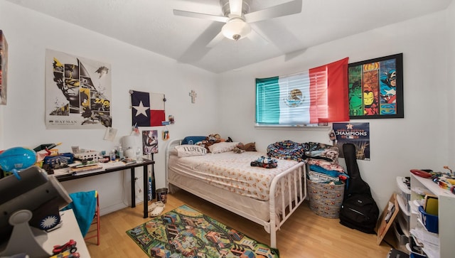 bedroom with ceiling fan and light hardwood / wood-style flooring