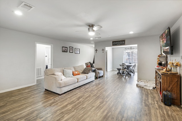 living room with ceiling fan and wood-type flooring