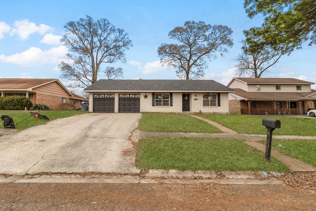 view of front facade featuring a garage and a front lawn