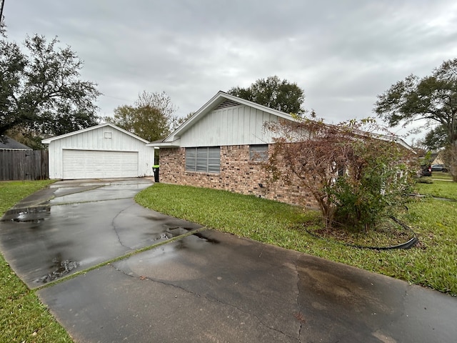 view of side of property with a yard and a garage