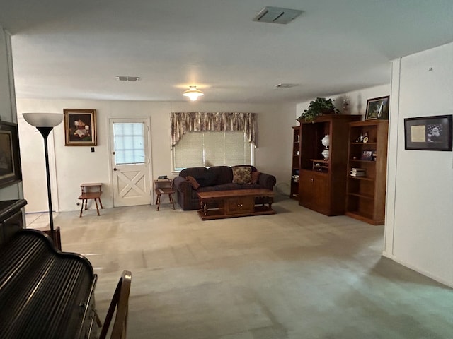 living room featuring light carpet