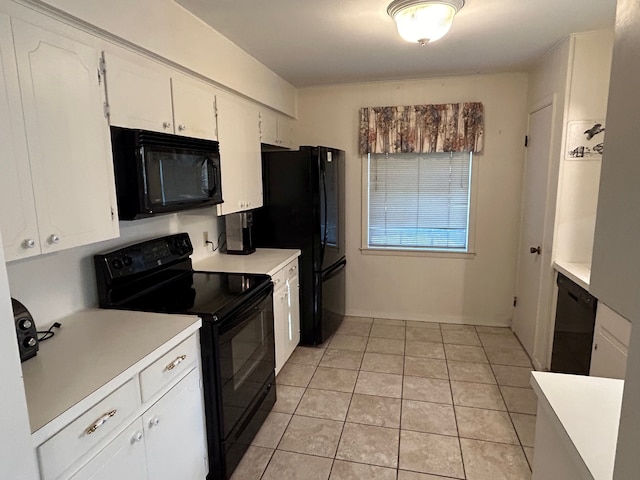 kitchen featuring light tile patterned flooring, white cabinetry, and black appliances